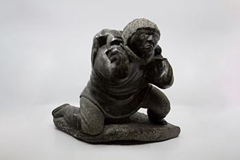 Kneeling Man Carrying Seal by Lucassie Ikkidluak sold for $344