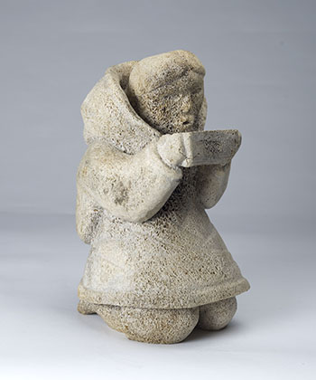 Kneeling Woman Holding a Qulliq by Unidentified Inuit Artist sold for $2,250