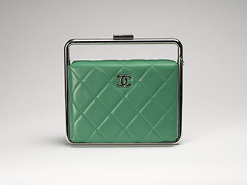 A RARE GREEN QUILTED LAMBSKIN LEATHER METAL BAR FRAME CLUTCH WITH STRAP by  CHANEL sold for $6,250