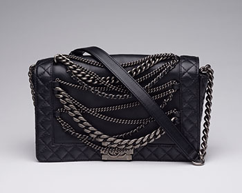 A BLACK LEATHER ENCHAINED MEDIUM BOY BAG WITH ANTIQUED SILVER-TONE HARDWARE by  CHANEL