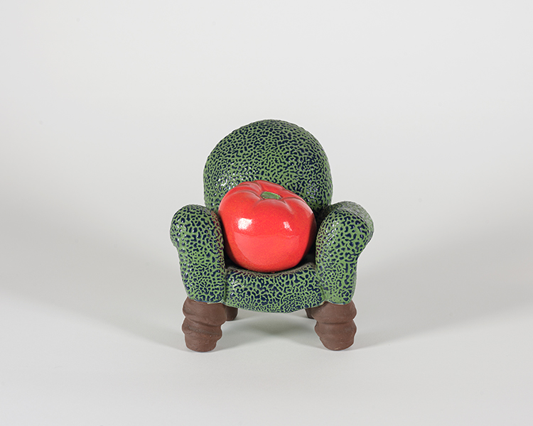 Tomato in Armchair by Victor Cicansky